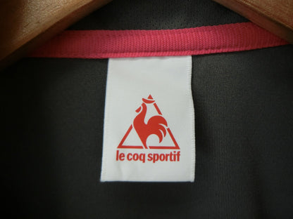 le coq sportif(ルコックスポルティフ) 半袖ハーフジップナイロンシャツ グレー レディース L A