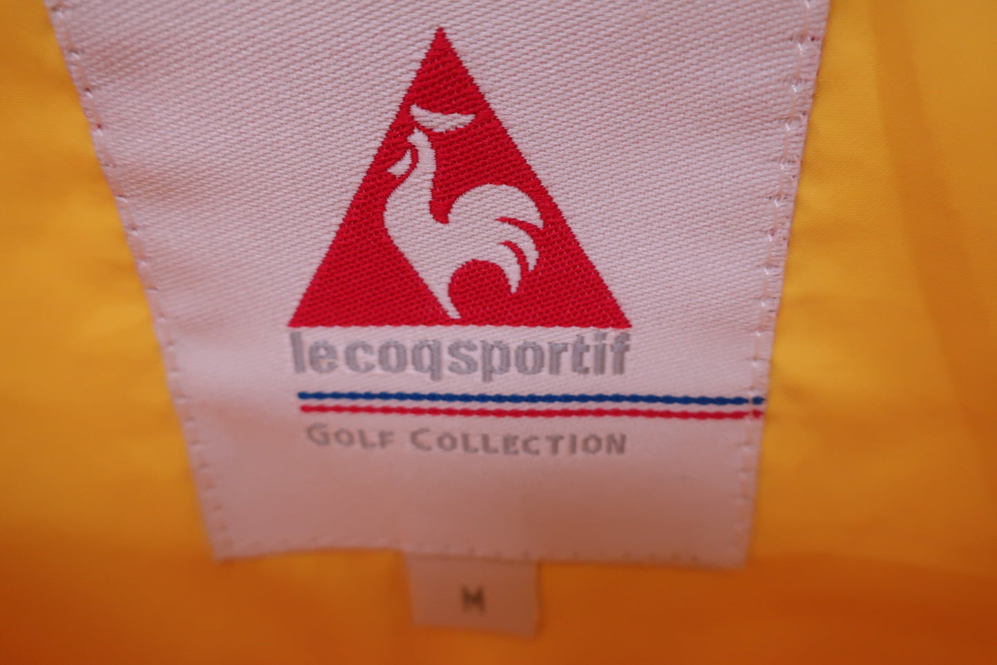 le coq sportif(ルコックスポルティフ) ハーフジップウィンドブレーカー 黄色 レディース M A