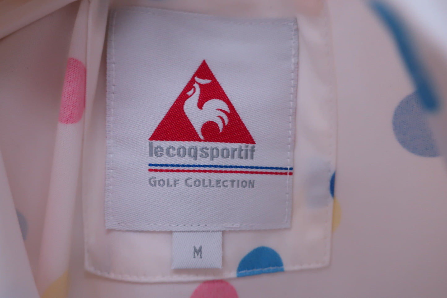 le coq sportif(ルコックスポルティフ) ウィンドブレーカー 白カラフルドット柄 レディース M B