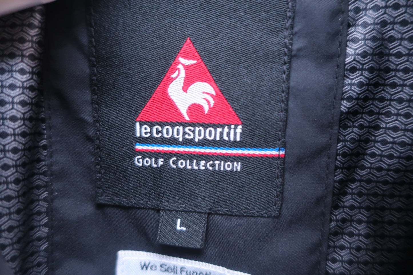 le coq sportif(ルコックスポルティフ) 半袖ハーフジップウィンドブレーカー 黒 メンズ L A