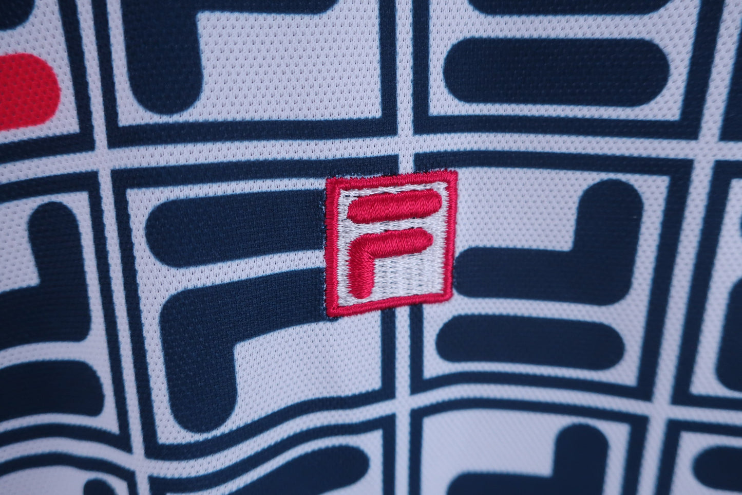 FILA GOLF(フィラゴルフ) ポロシャツ 白紺ブランドロゴ総柄 レディース LL A