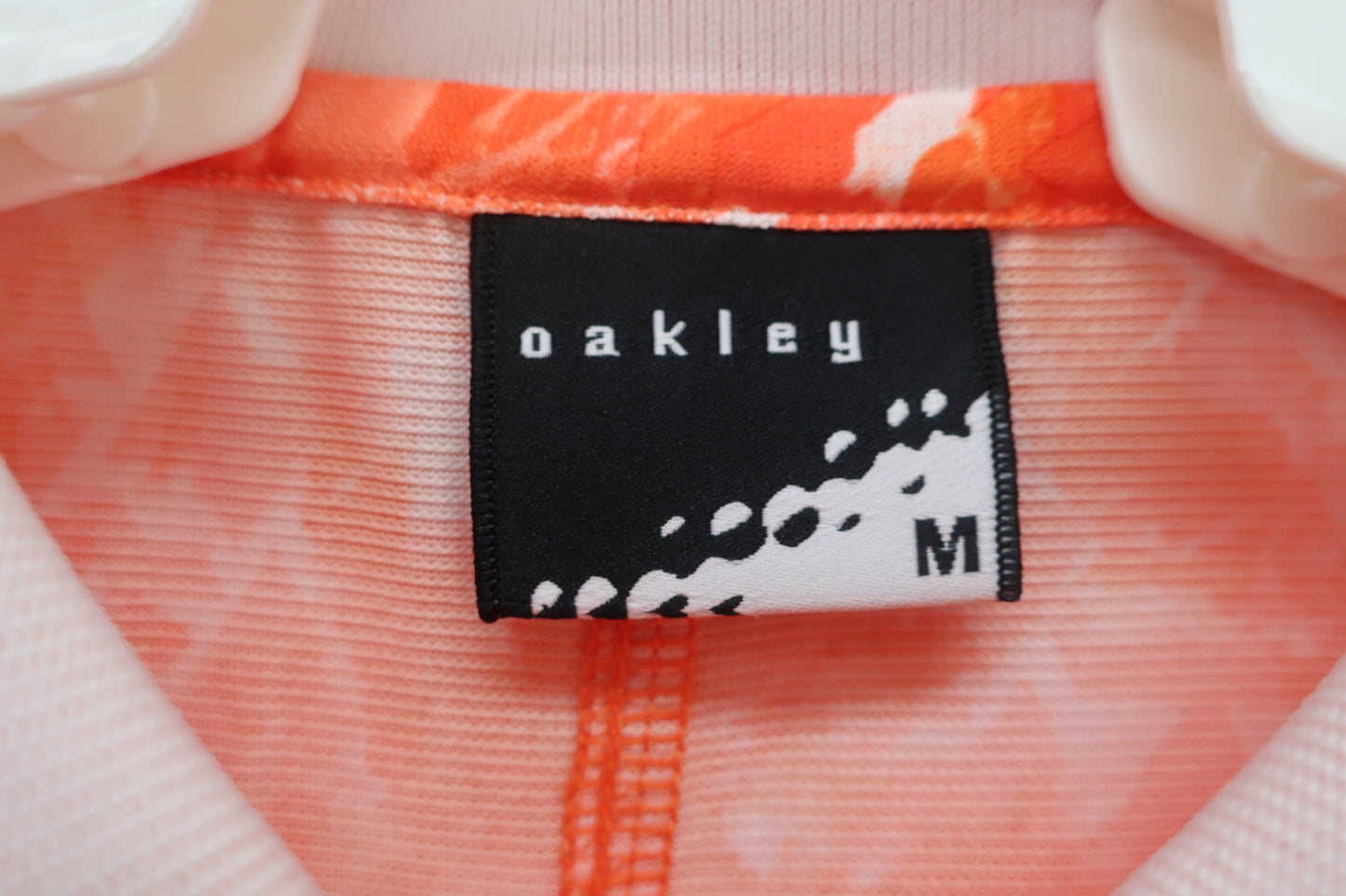 OAKLEY(オークリー) ポロシャツ オレンジ レディース M A