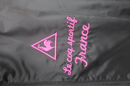 le coq sportif(ルコックスポルティフ) 半袖ナイロンブルゾン 黒地ピンク白 レディース M A-2