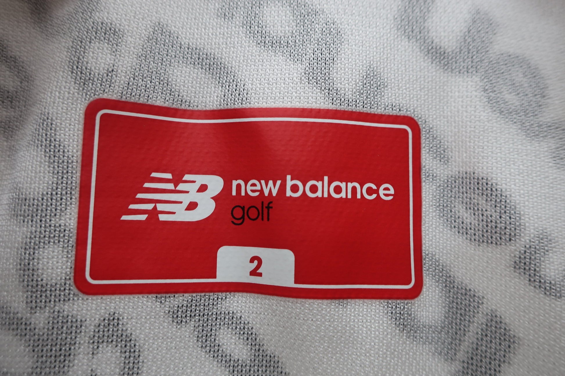 New Balance golf(ニューバランスゴルフ) 半袖ポロシャツ 白黒ブランド名柄 レディース 2 B-3