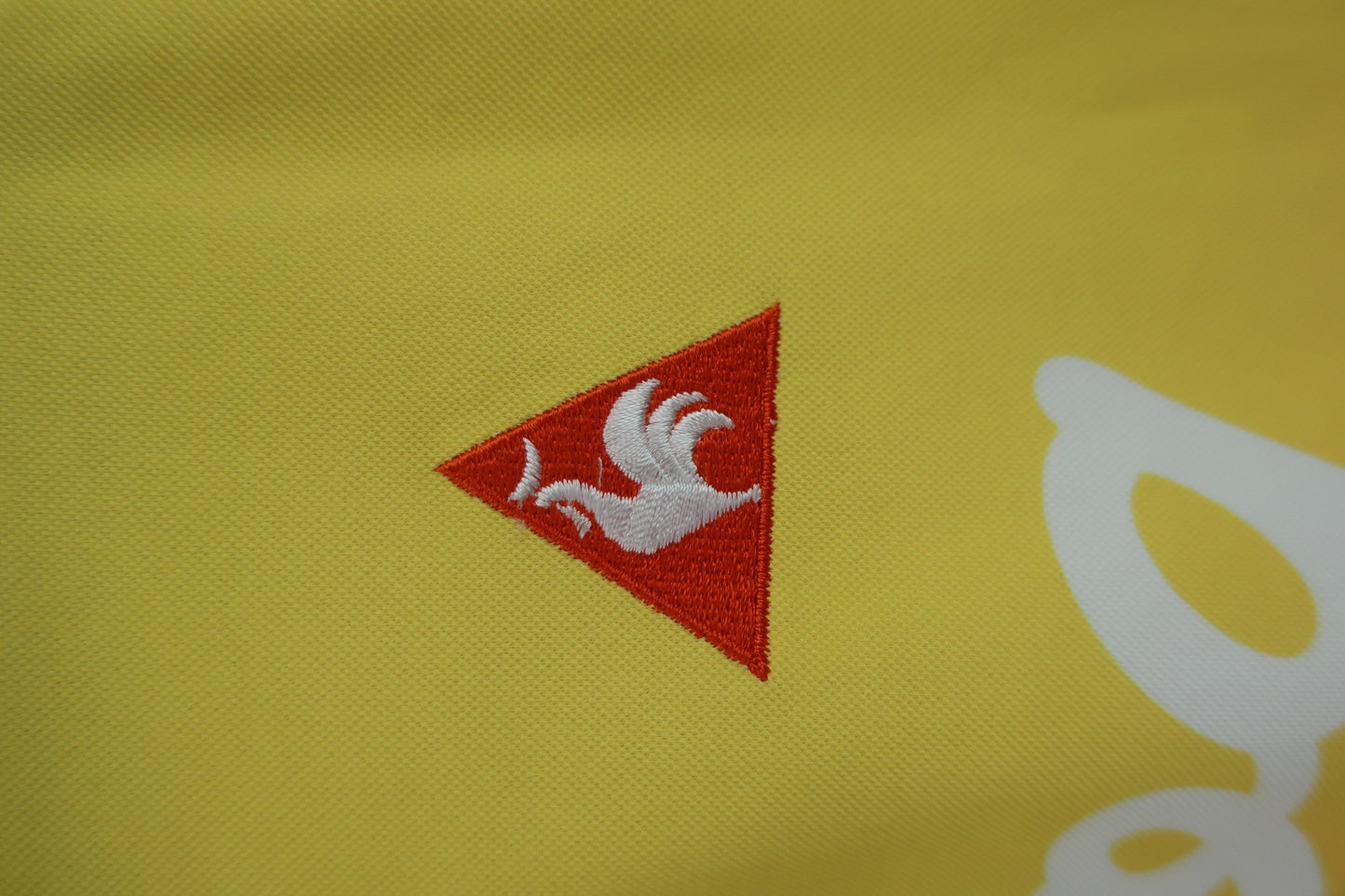 le coq sportif(ルコックスポルティフ) 半袖ハーフジップシャツ 黄色オレンジ レディース L B-2