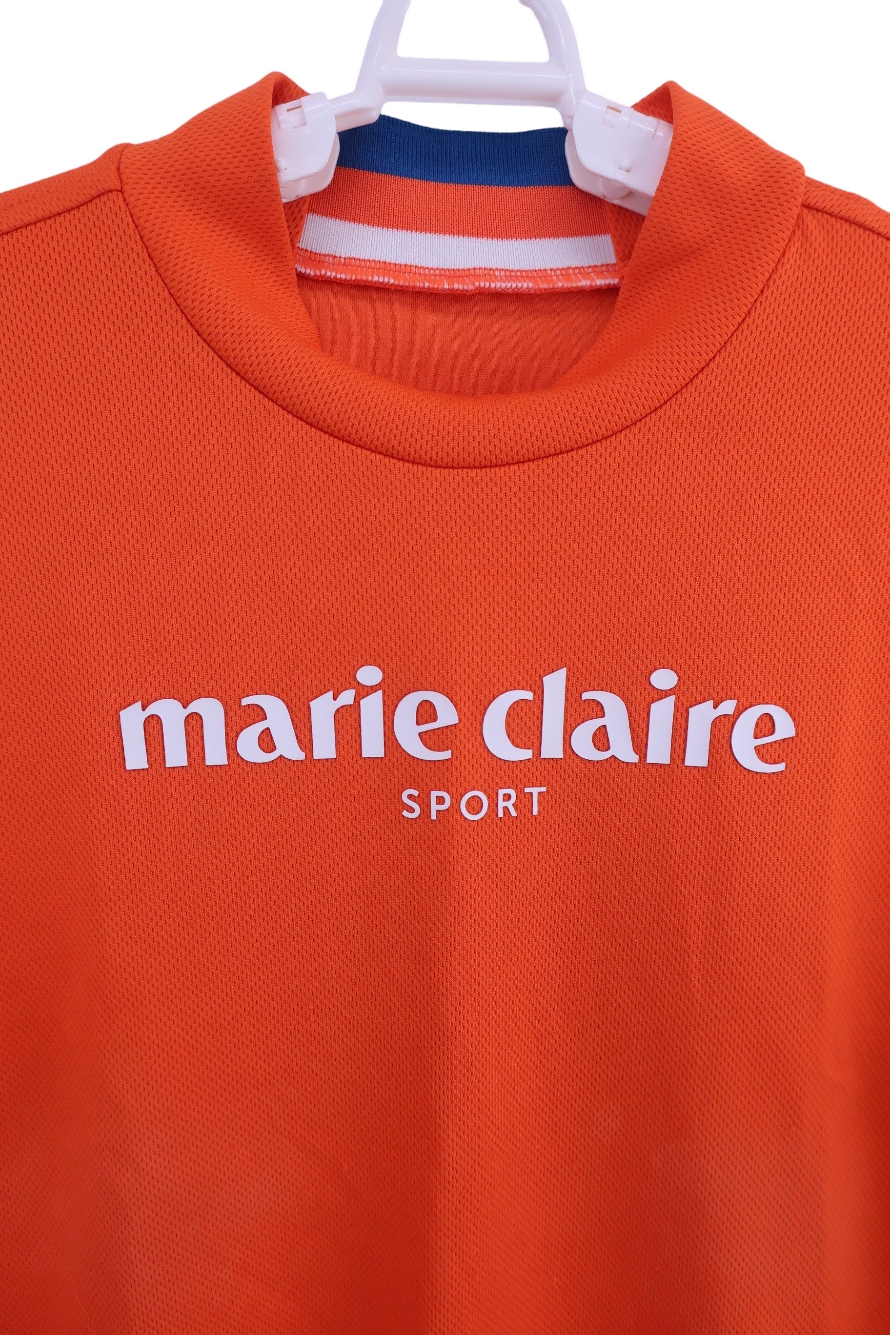 marie claire sport(マリ・クレール・スポーツ) 半袖モックネックシャツ オレンジ レディース LL B
