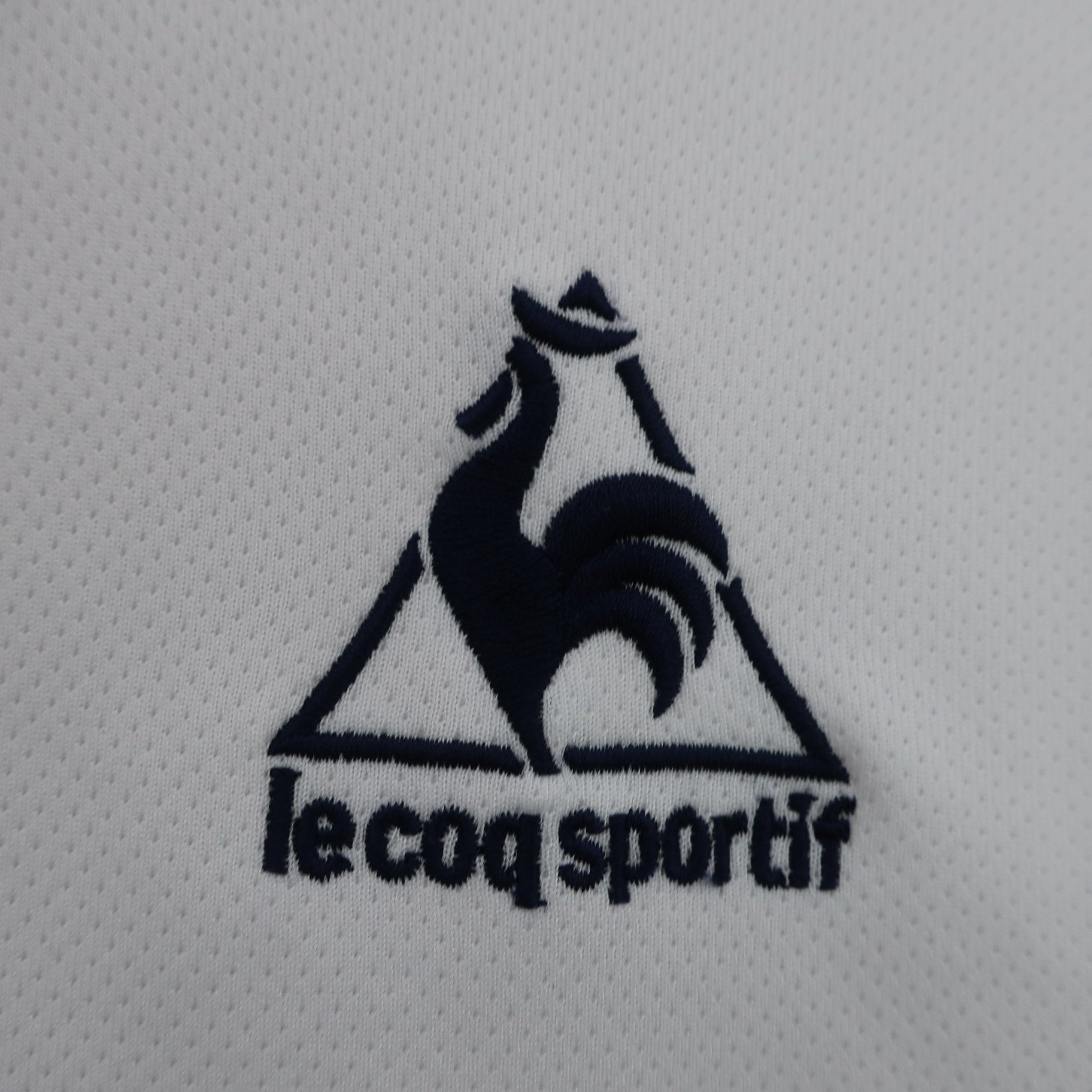 le coq sportif(ルコックスポルティフ) 半袖ハーフジップシャツ 白 メンズ O A