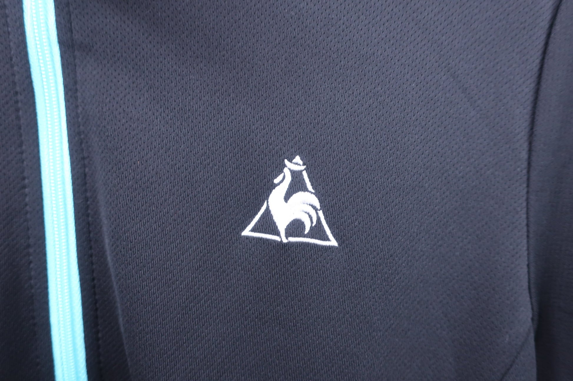 le coq sportif(ルコックスポルティフ) 半袖ハーフジップシャツ 黒水色 メンズ O A
