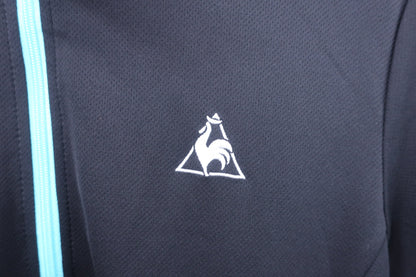 le coq sportif(ルコックスポルティフ) 半袖ハーフジップシャツ 黒水色 メンズ O A