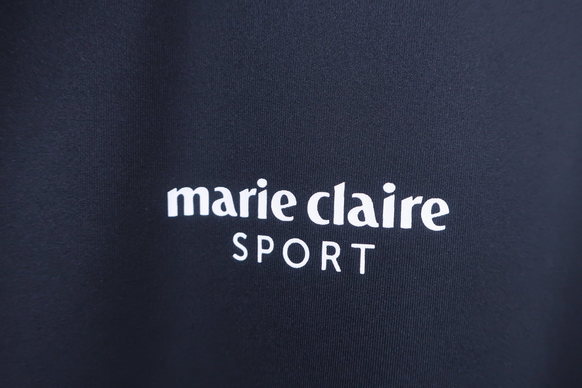 marie claire sport(マリ・クレール・スポーツ) 半袖モックネックシャツ 黒白 レディース L A