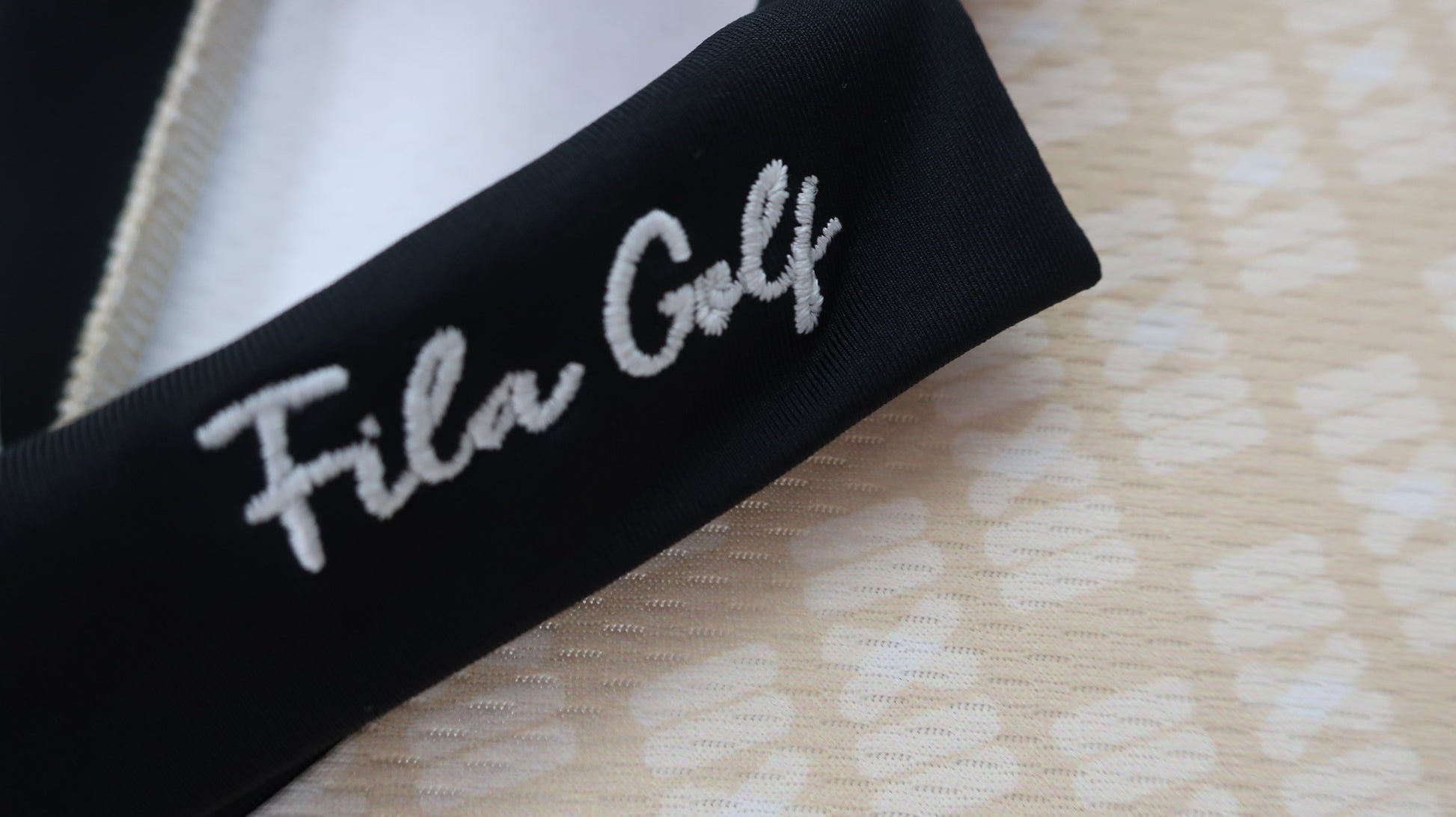 FILA GOLF(フィラゴルフ) ポロシャツ ベージュロゴ柄 レディース M A