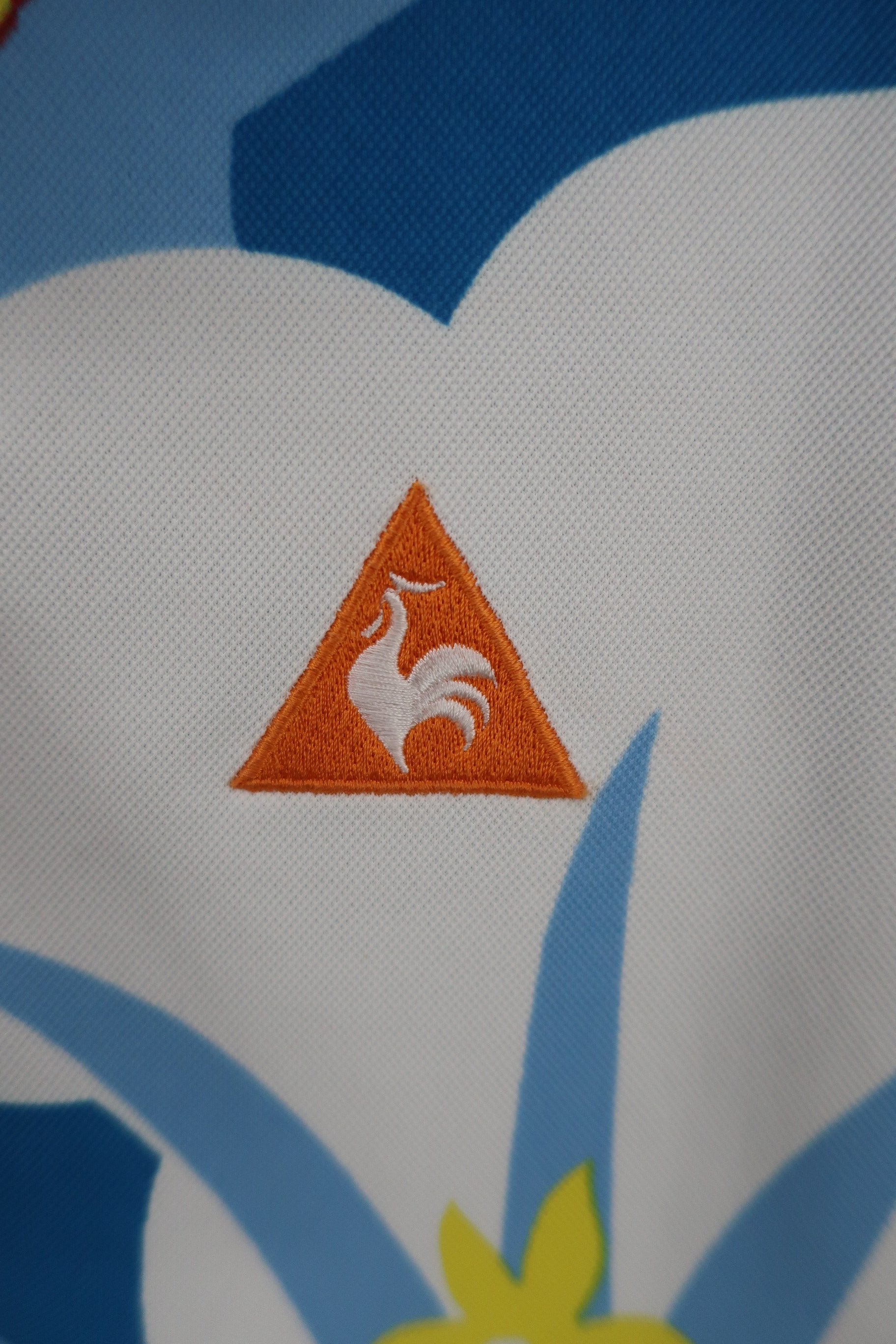le coq sportif(ルコックスポルティフ) ポロシャツ 水色総柄 レディース LL A