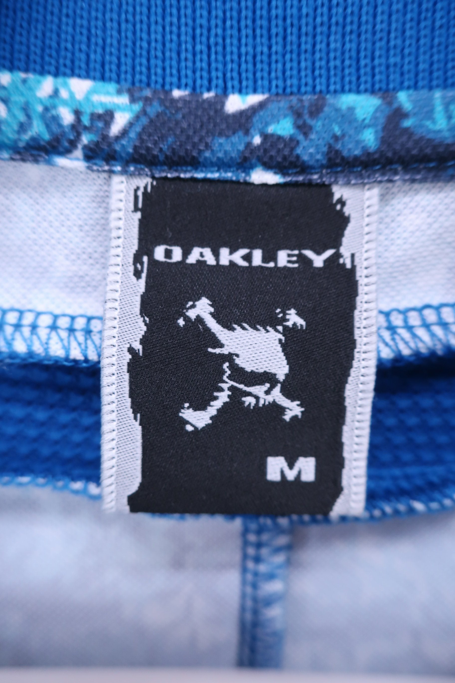 OAKLEY(オークリー) ポロシャツ 青総柄 メンズ M A