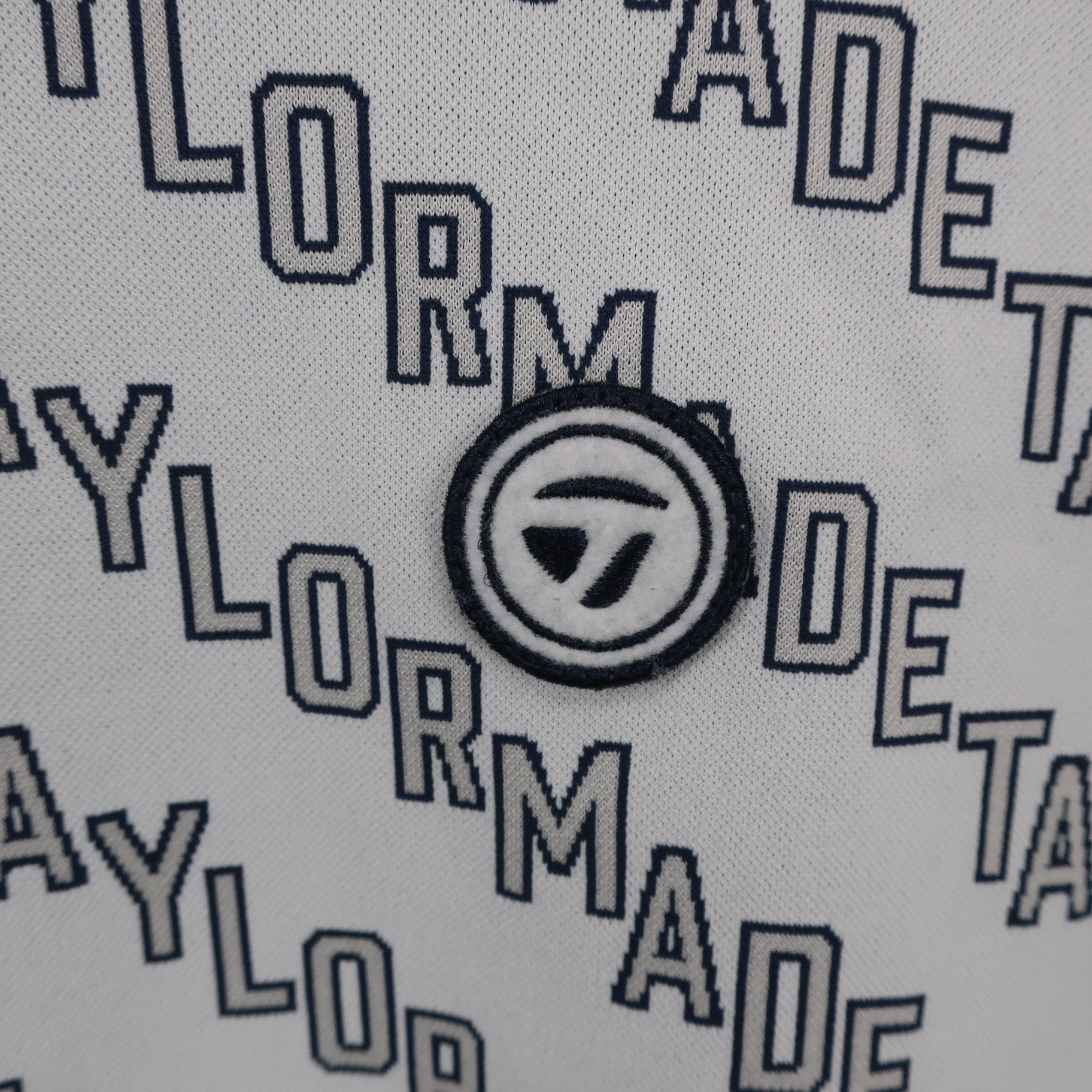 TaylorMade(テーラーメイド) 長袖モックネックシャツ グレーロゴ文字柄 レディース M A