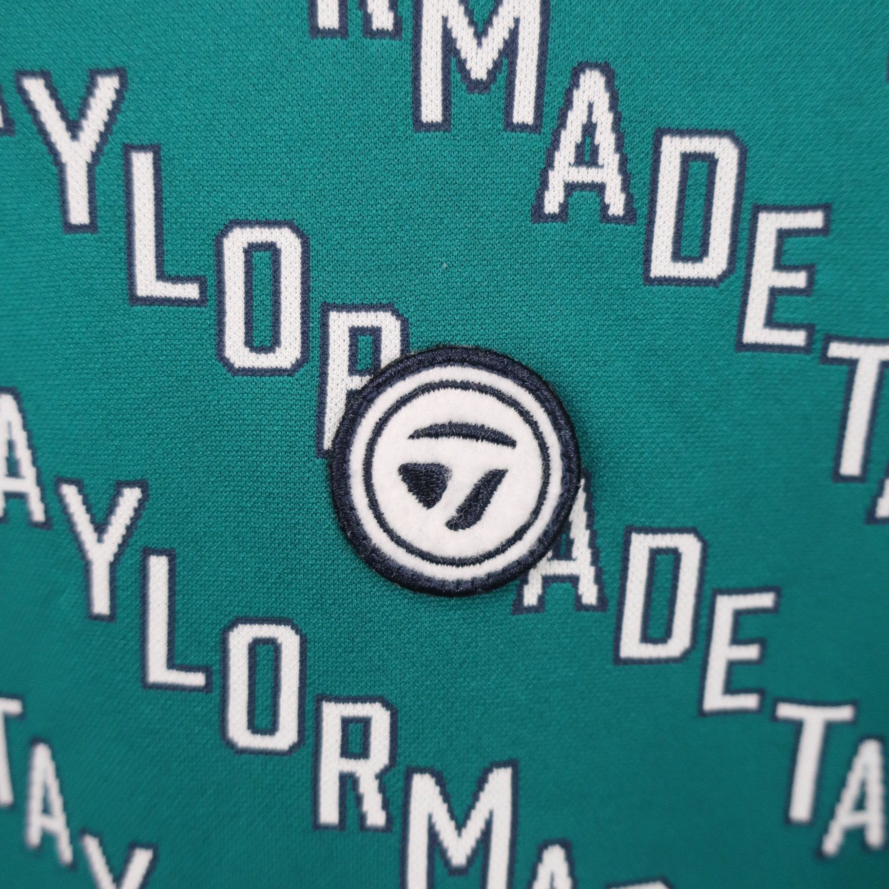 TaylorMade(テーラーメイド) 長袖モックネックシャツ 緑ロゴ文字柄 レディース M A
