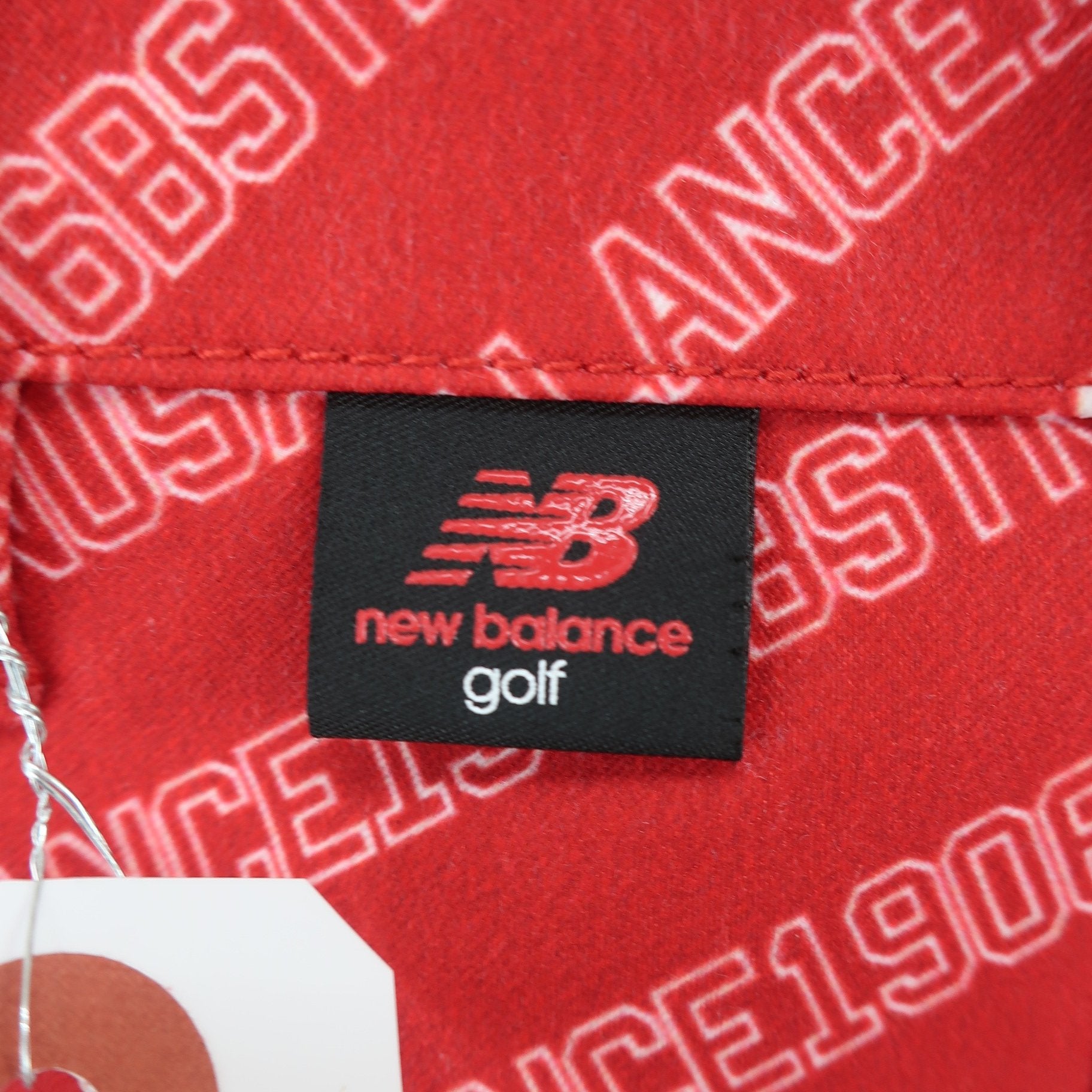 New Balance golf(ニューバランスゴルフ) パンツ 赤白ロゴ文字柄 メンズ 7 012-9131011 B