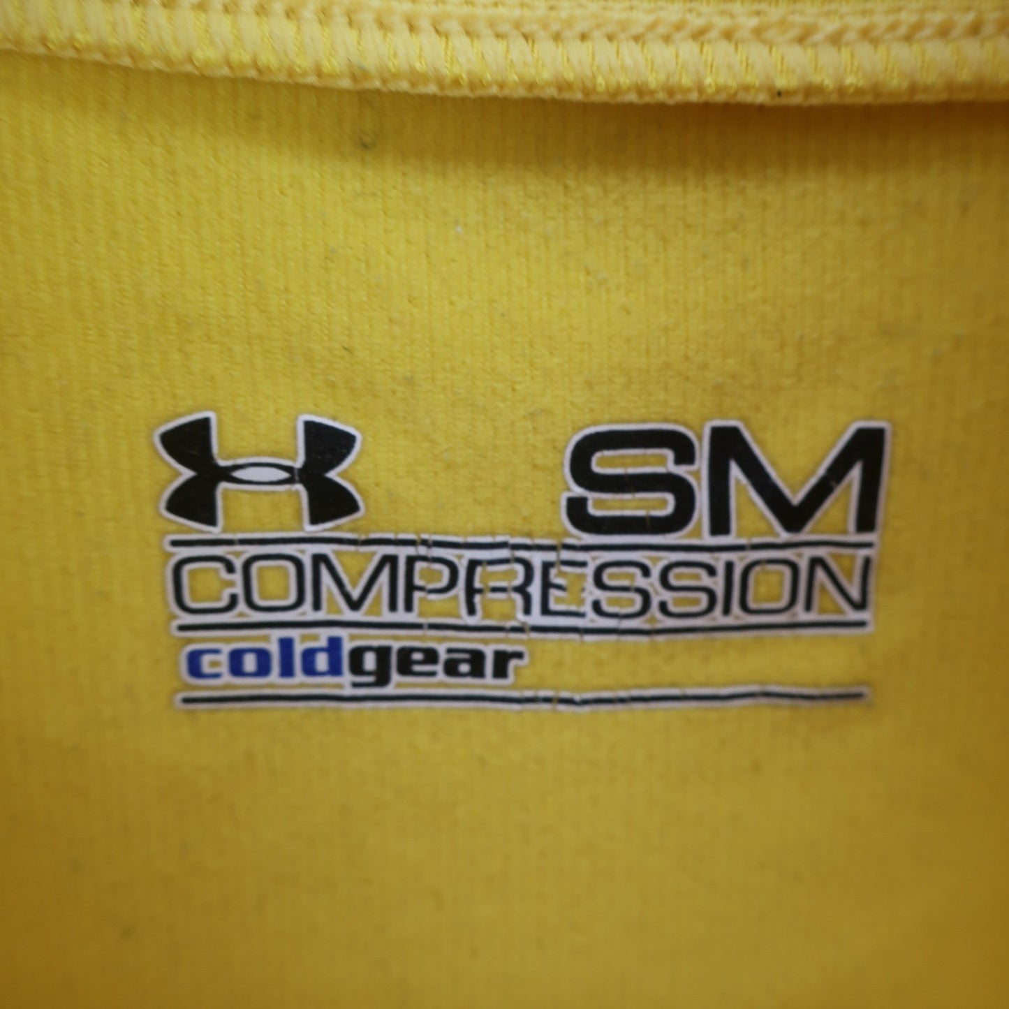 UNDER ARMOUR(アンダーアーマー) ハイネックシャツ 黄色 レディース SM A