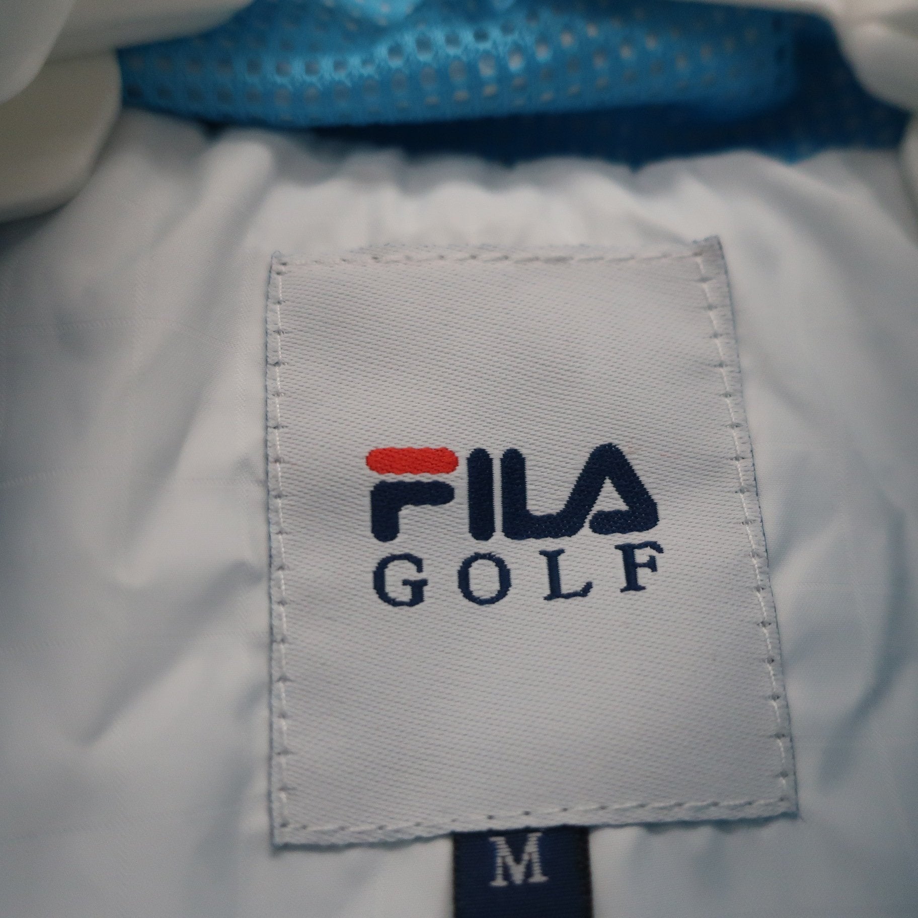 FILA GOLF(フィラゴルフ) 半袖フルジップナイロン 白 レディース M B