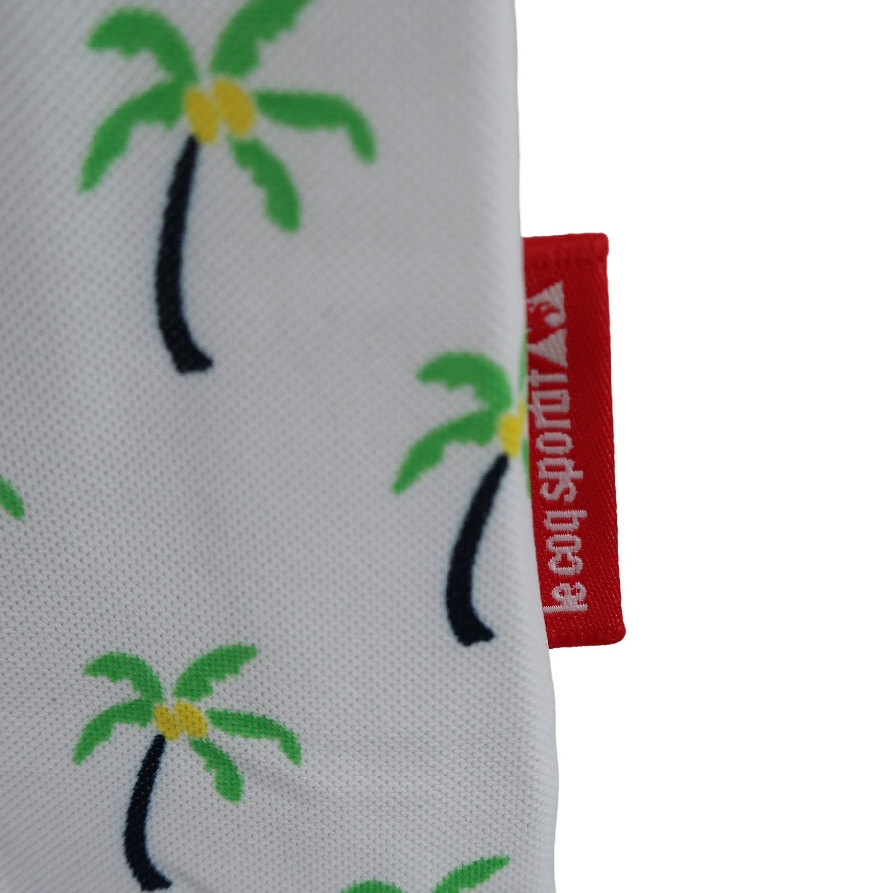 le coq sportif(ルコックスポルティフ) ポロシャツ 白ヤシの木柄 レディース M A