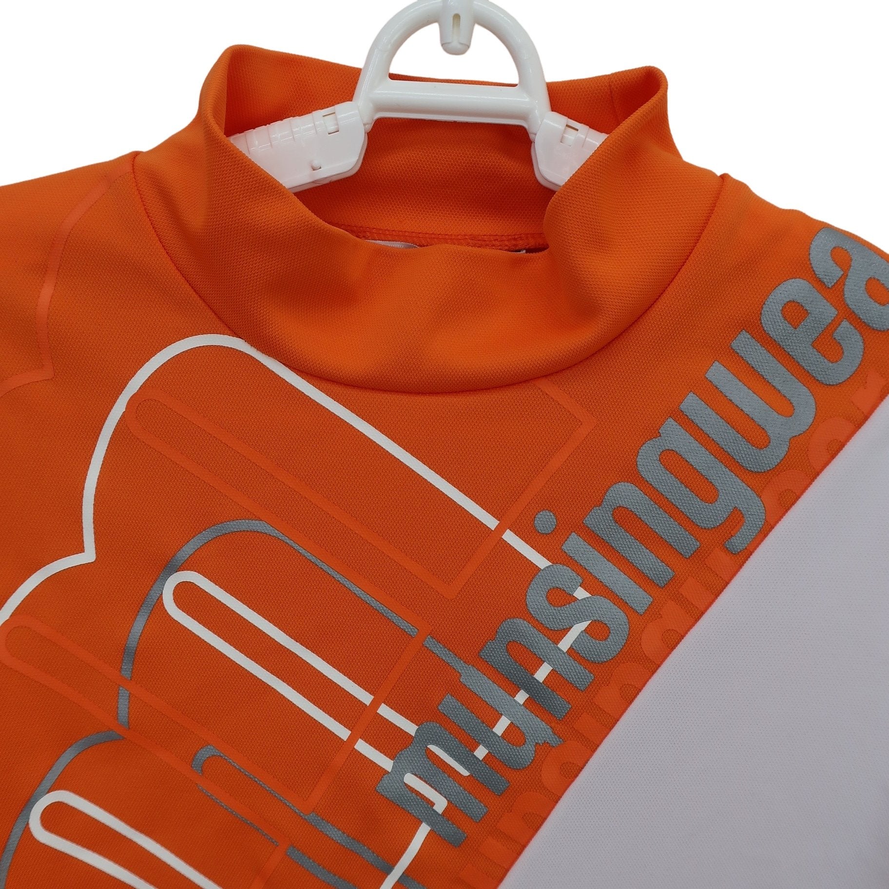 Munsingwear(マンシングウェア) 半袖モックネックシャツ オレンジ白 レディース M B