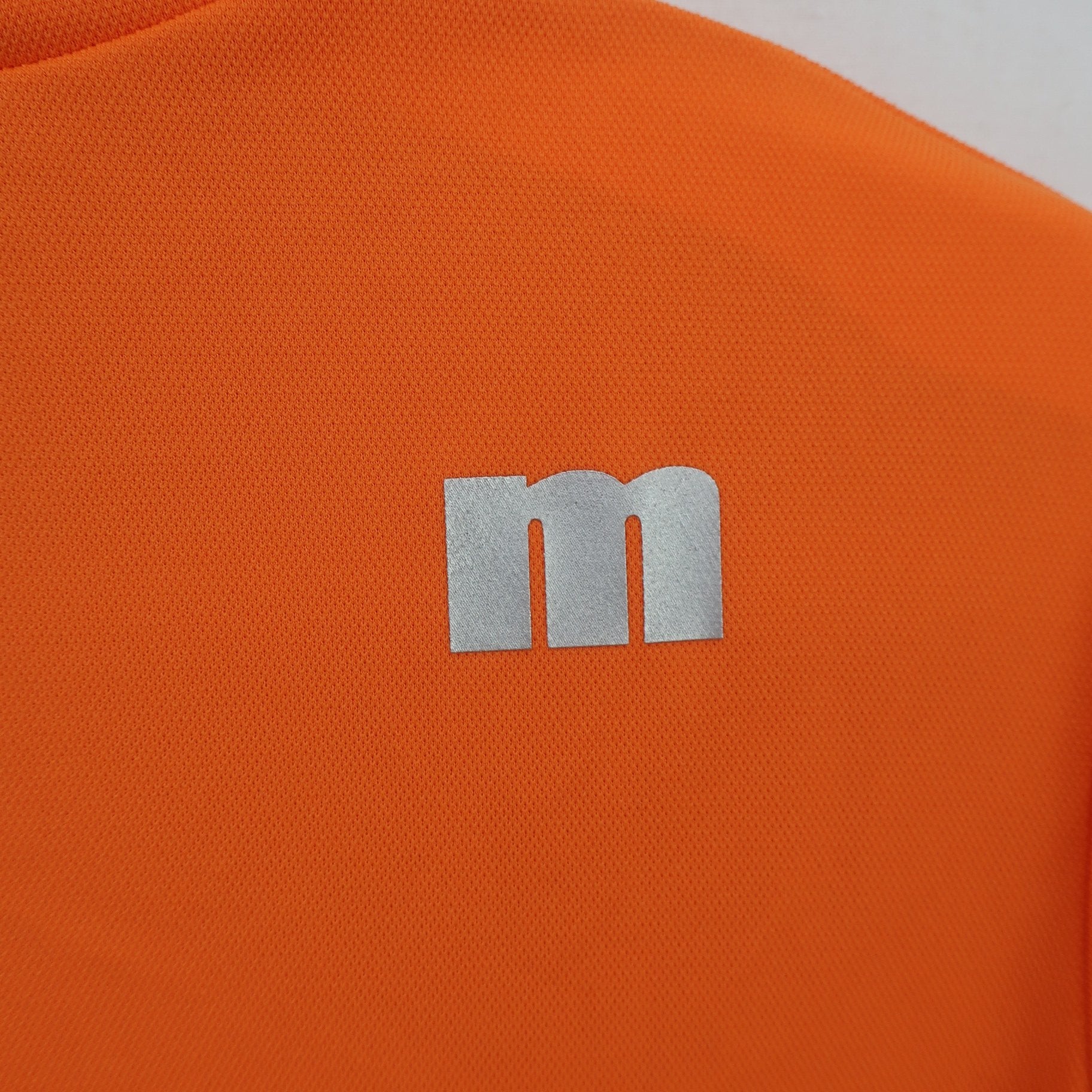 Munsingwear(マンシングウェア) 半袖モックネックシャツ オレンジ白 レディース M B