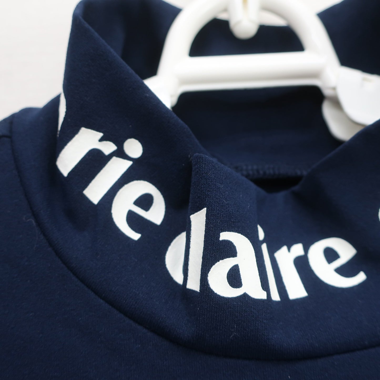 marie claire sport(マリ・クレール・スポーツ) 長袖モックネックシャツ ネイビー レディース S A