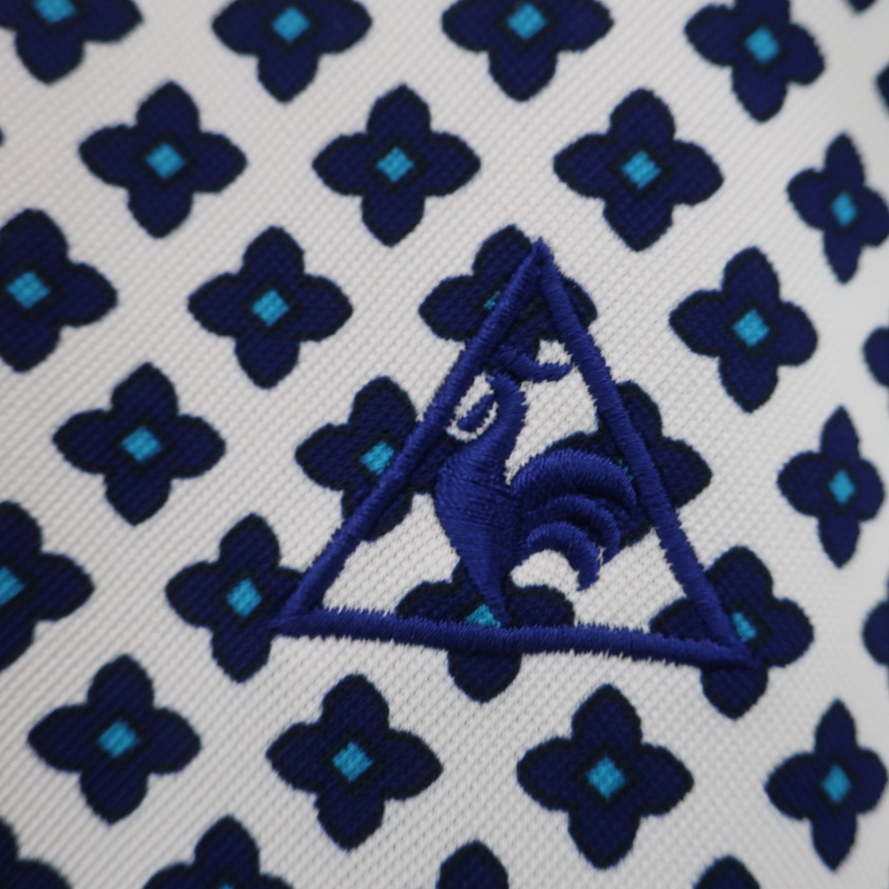 le coq sportif(ルコックスポルティフ) ポロシャツ 白ネイビー総柄 レディース L A