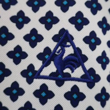 le coq sportif(ルコックスポルティフ) ポロシャツ 白ネイビー総柄 レディース L A