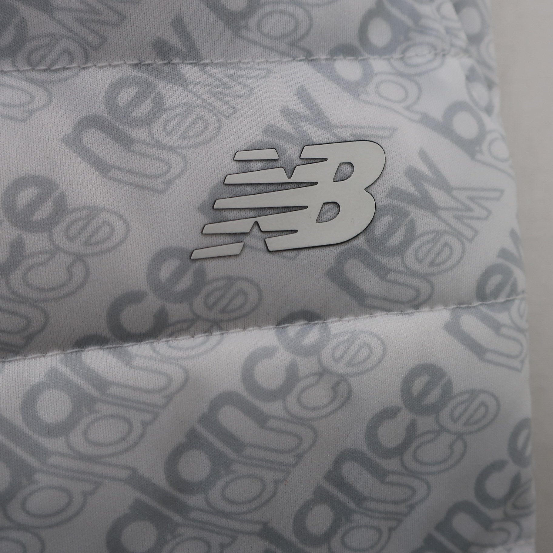 New Balance golf(ニューバランスゴルフ) ナイロンパンツ 白グレーロゴ柄 メンズ 4 012-9231003 A