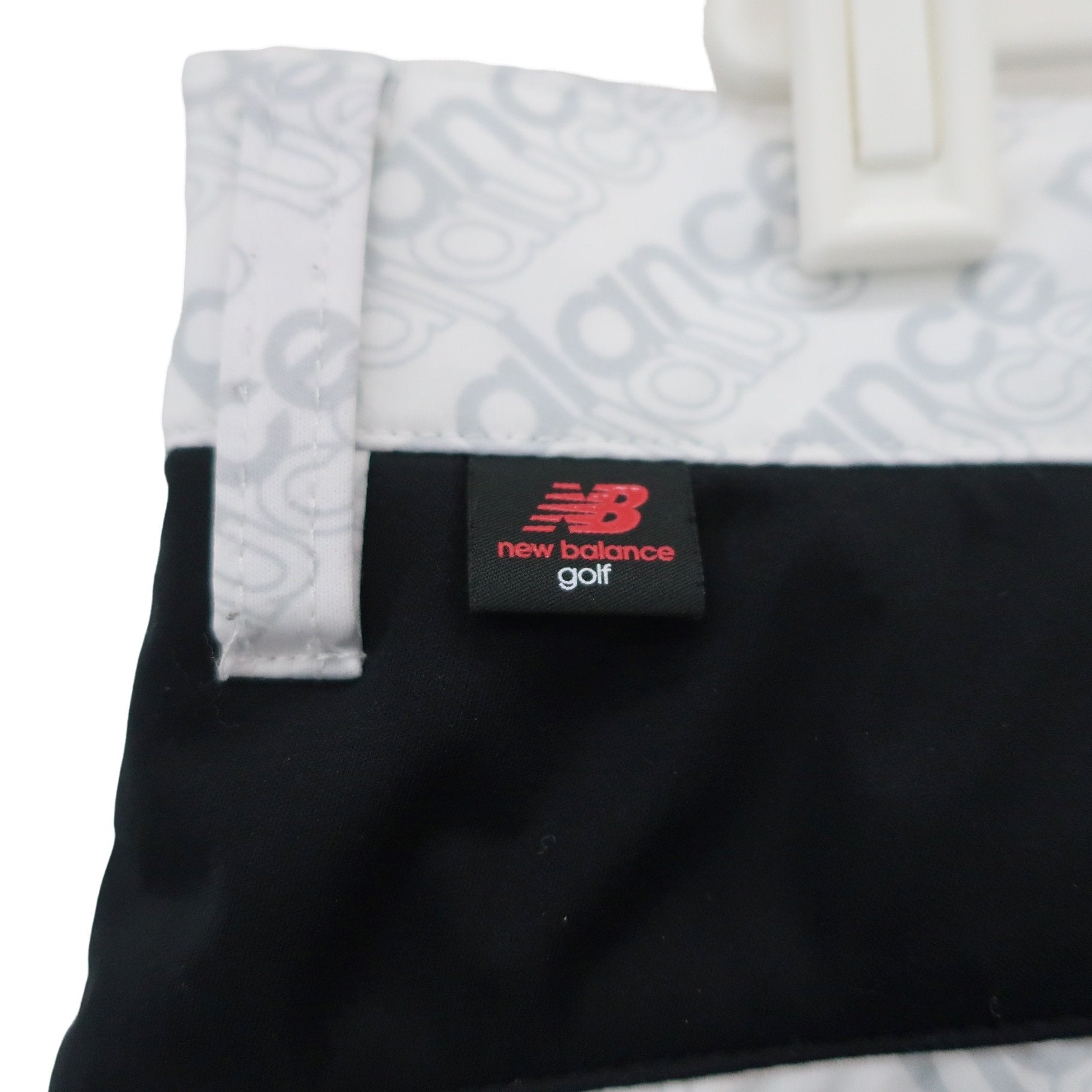 New Balance golf(ニューバランスゴルフ) ナイロンパンツ 白グレーロゴ柄 メンズ 4 012-9231003 A