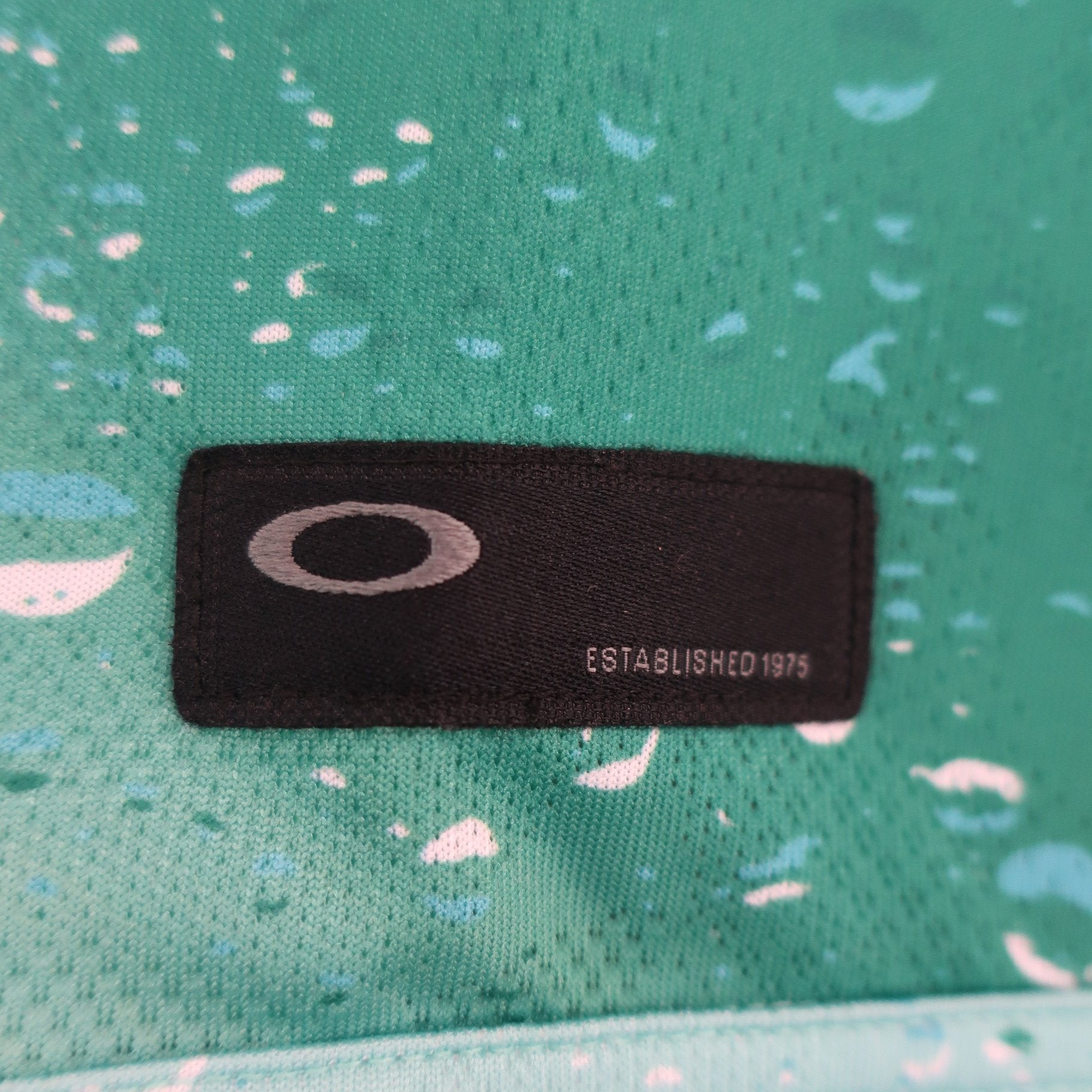 OAKLEY(オークリー) ハーフジップポロシャツ 緑総柄 メンズ M A