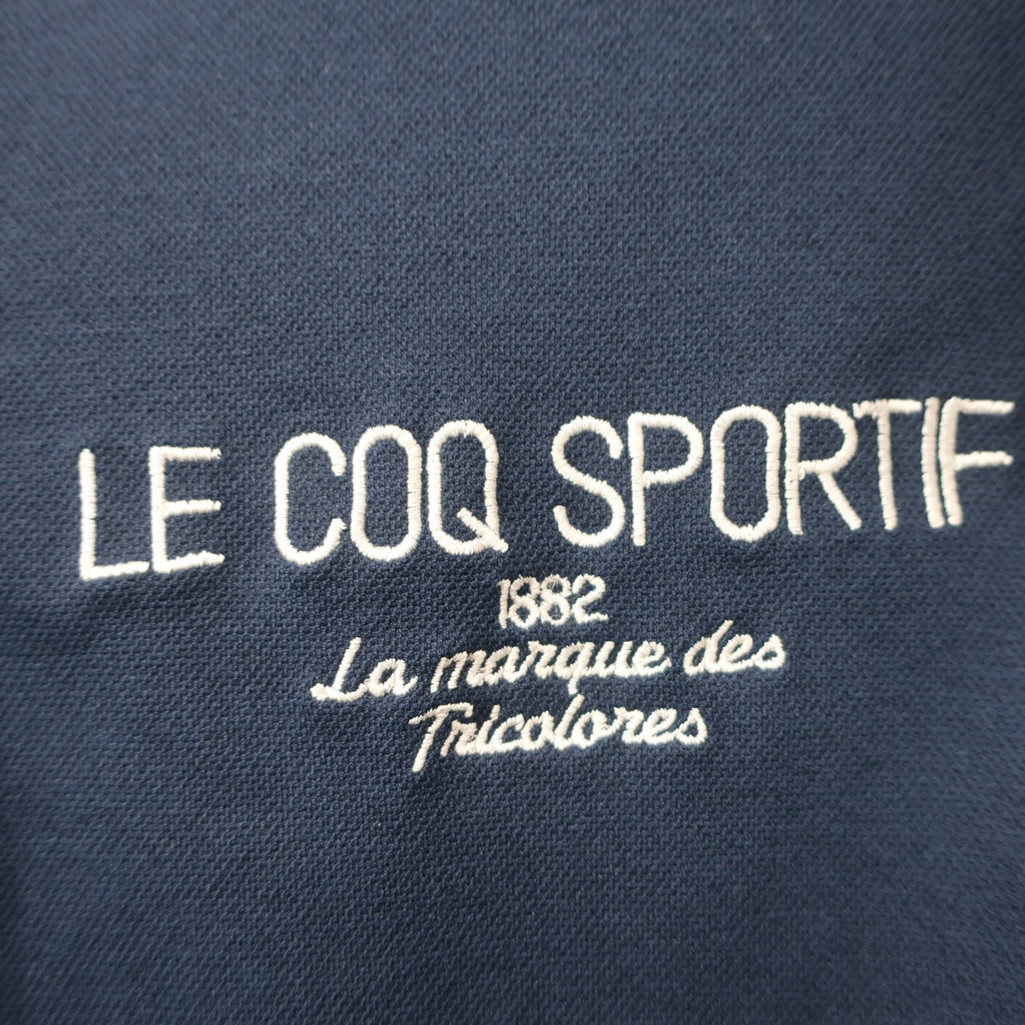 le coq sportif(ルコックスポルティフ) 半袖ハーフジップシャツ ネイビー レディース S A