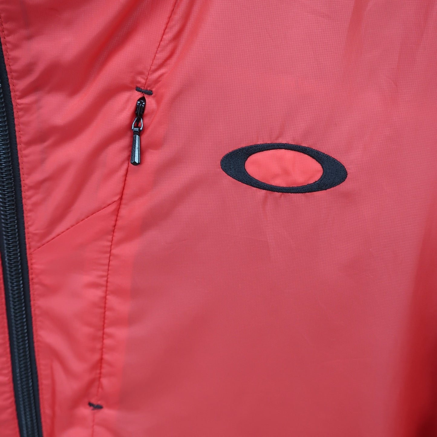 OAKLEY(オークリー) ナイロンパーカー 赤 メンズ L A