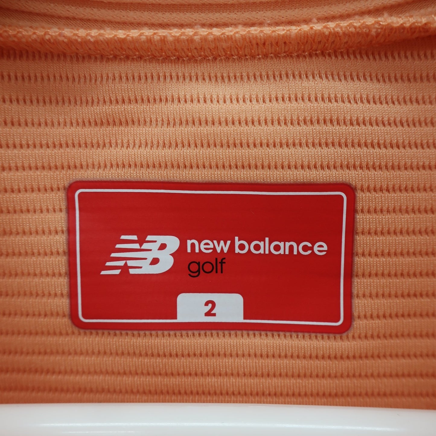 New Balance golf(ニューバランスゴルフ) 半袖モックネックシャツ オレンジ×ホワイト レディース 2 012-2166503 A