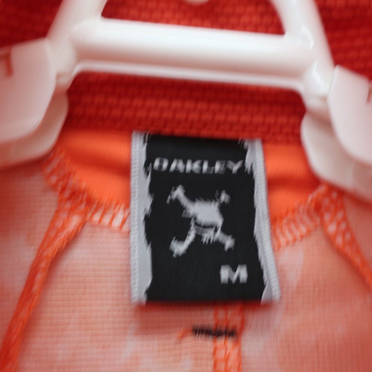 OAKLEY(オークリー) ポロシャツ オレンジ メンズ M A