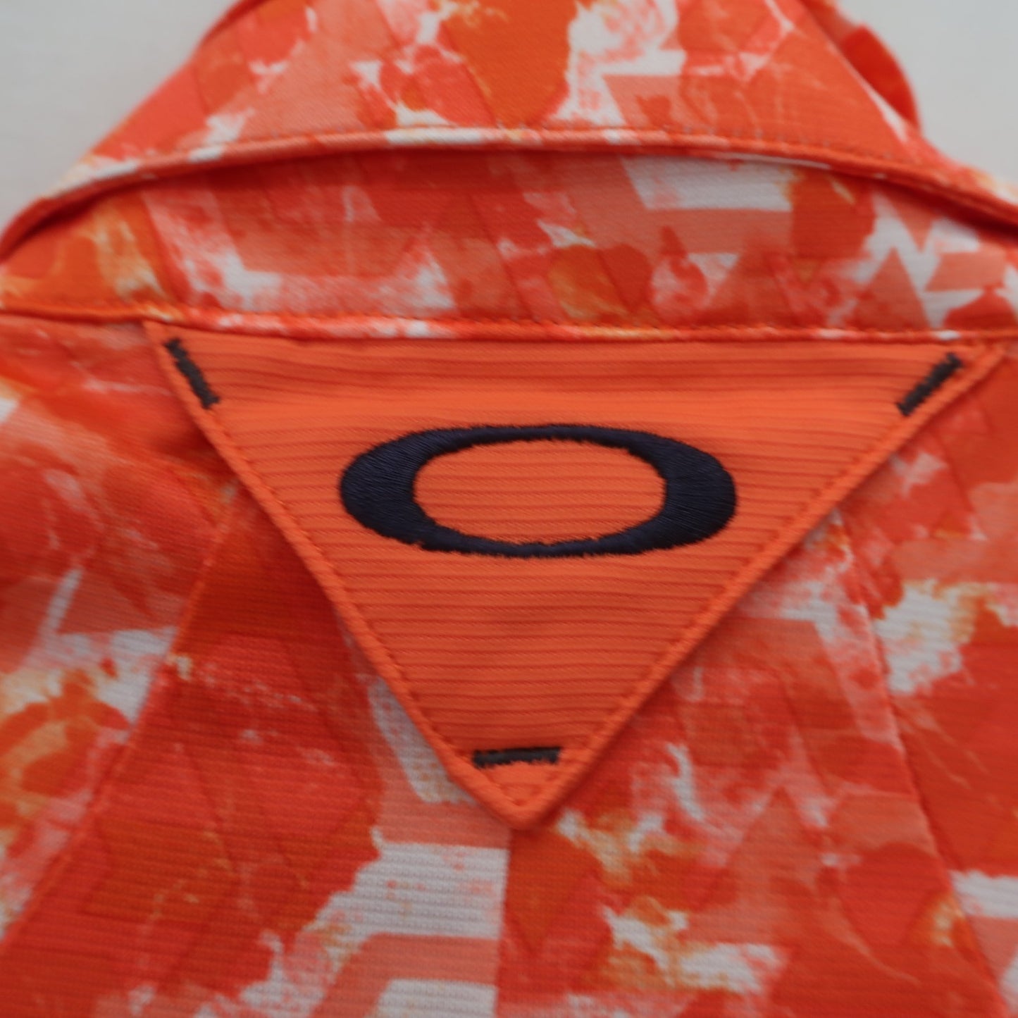 OAKLEY(オークリー) ポロシャツ オレンジ メンズ M A