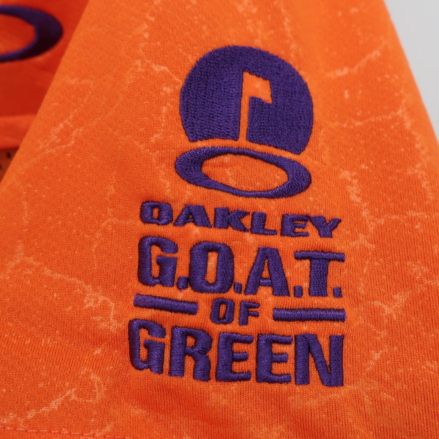 OAKLEY(オークリー) ポロシャツ オレンジ メンズ M A