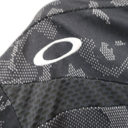 OAKLEY(オークリー) ポロシャツ 黒総柄 メンズ M A