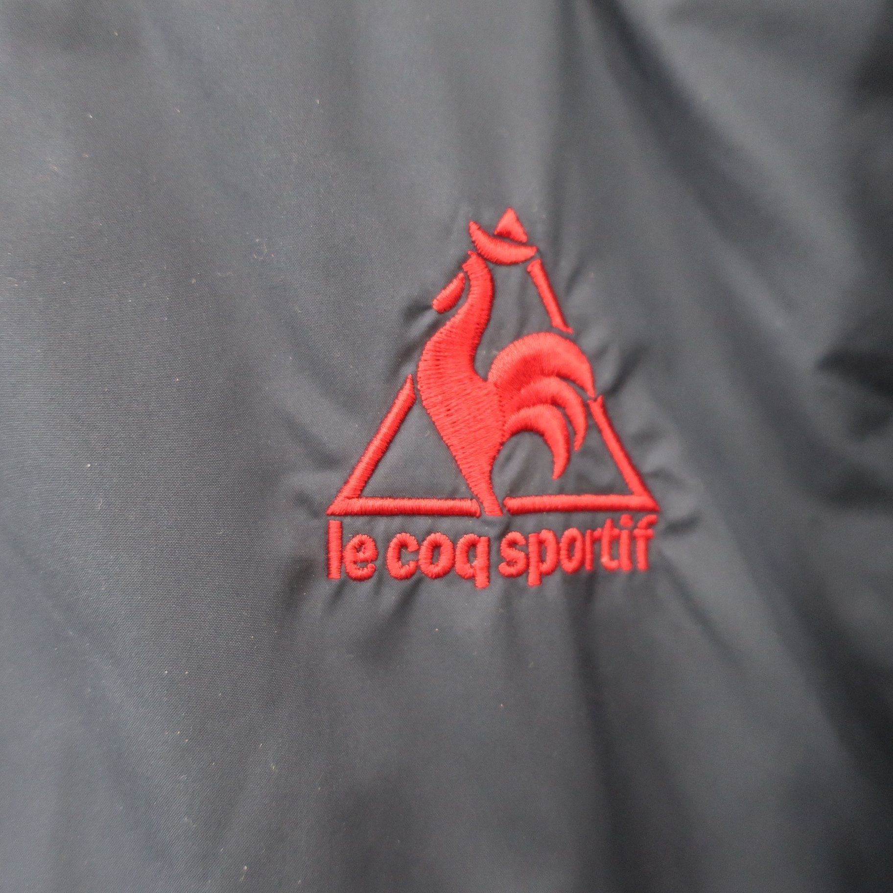 le coq sportif(ルコックスポルティフ) ナイロンベスト ネイビー×ホワイト メンズ L A