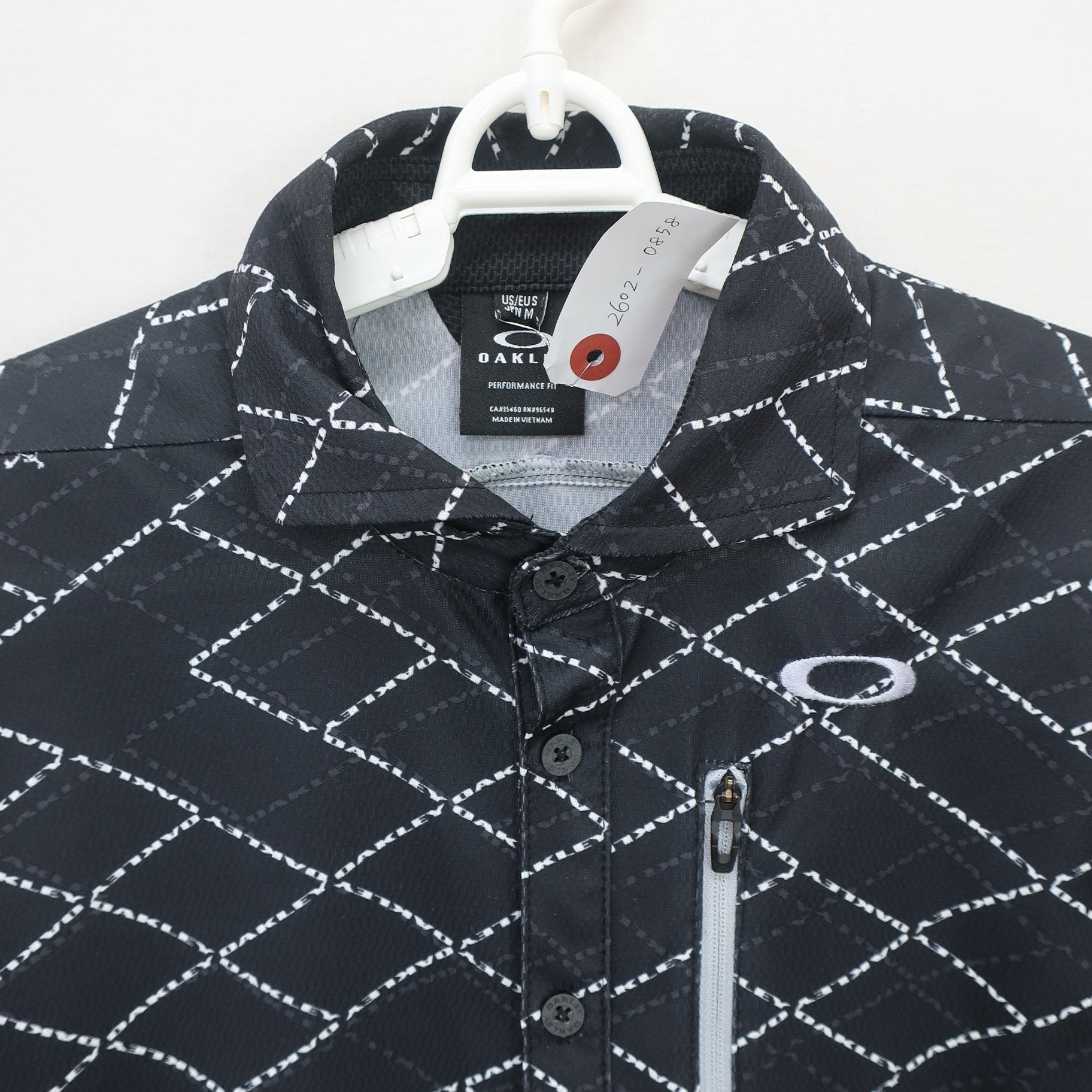 OAKLEY(オークリー) ポロシャツ 黒総柄 メンズ M A