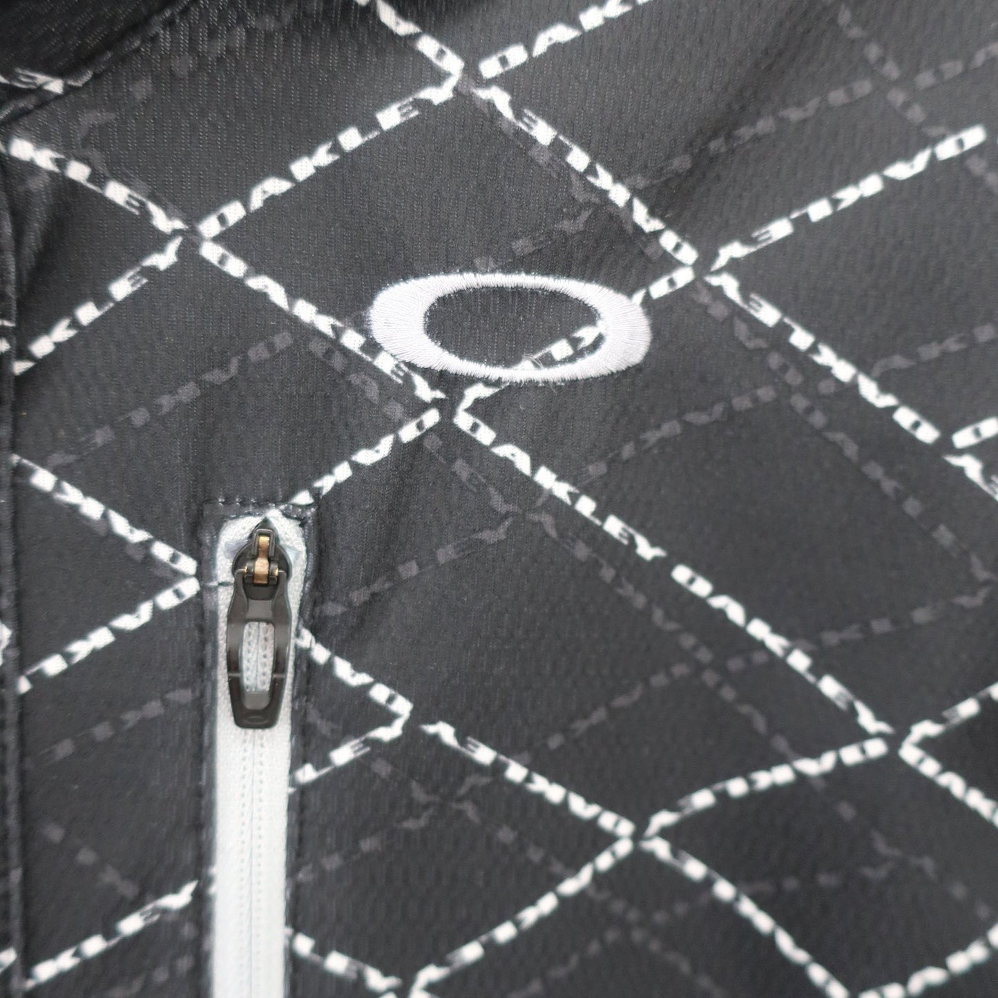 OAKLEY(オークリー) ポロシャツ 黒総柄 メンズ M A