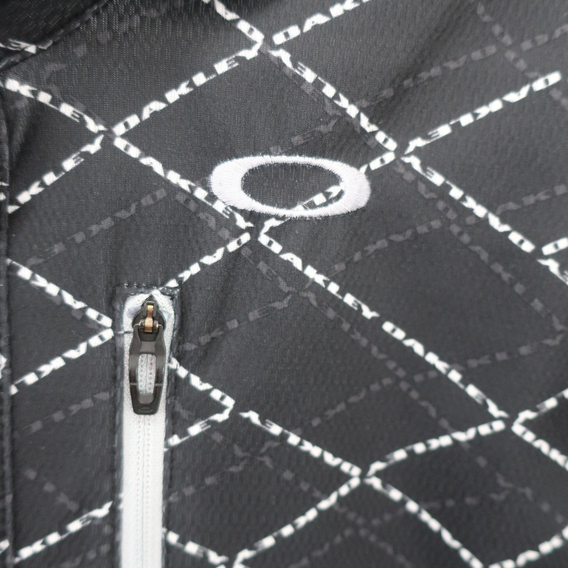 OAKLEY(オークリー) ポロシャツ 黒総柄 メンズ M A